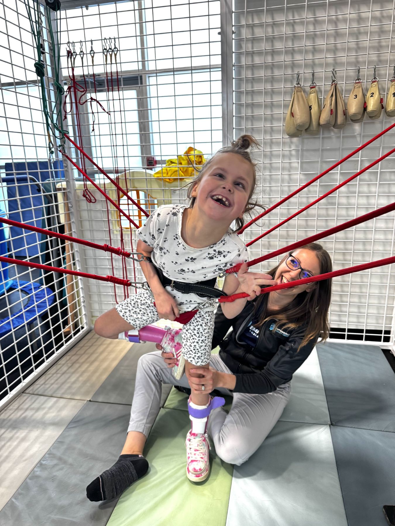 Intensive neuro session, suspension or TheraSuit equipment in use